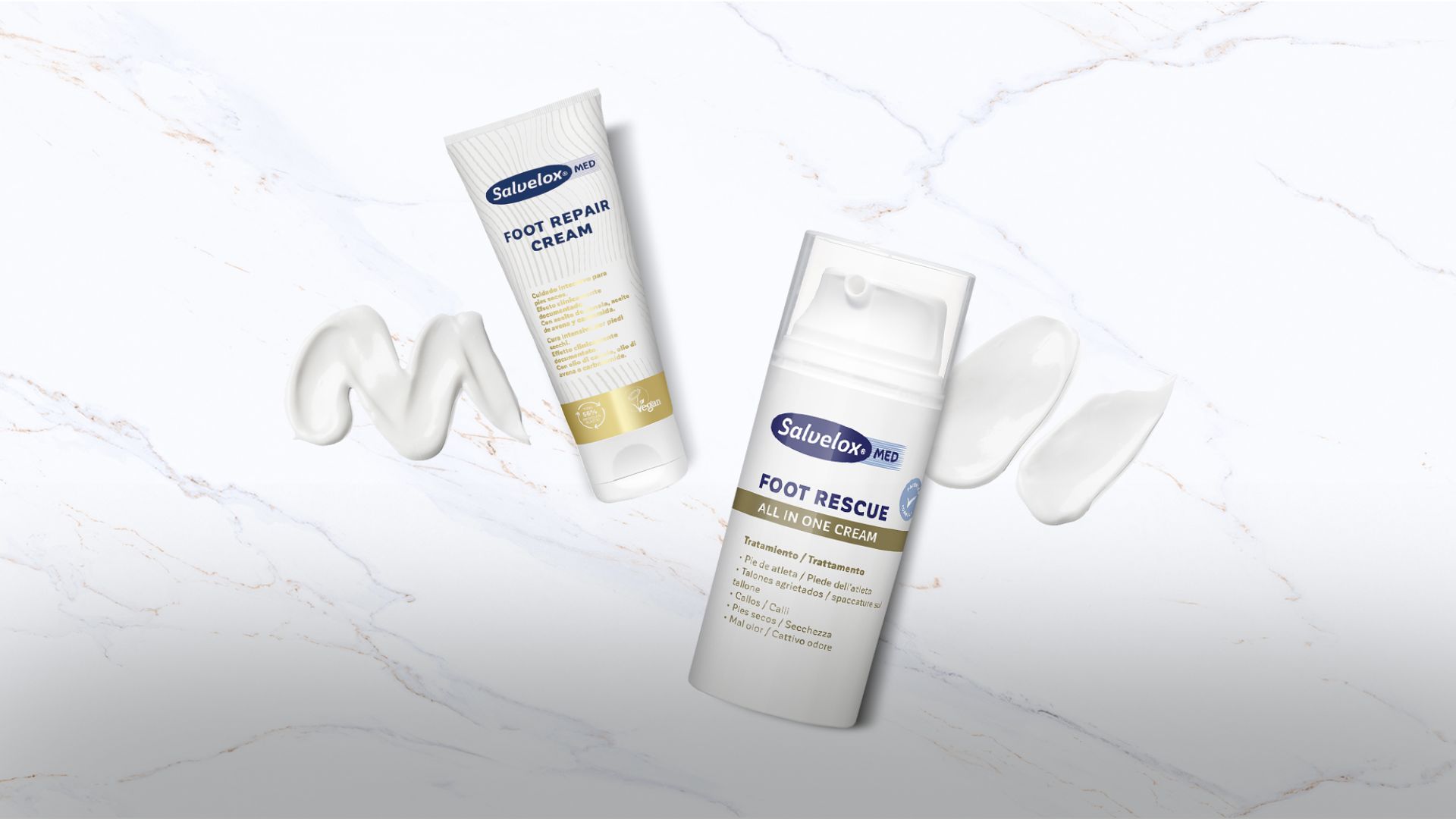 Crema reparadora para pies Salvelox Foot Repair Cream y crema todo en uno Salvelox Foot Rescue sobre fondo blanco con textura marmoleada. Tratamientos para pies secos, agrietados y con mal olor.